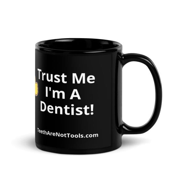 Black mug with the words "Teeth Are Not Tools" on two sides 11oz