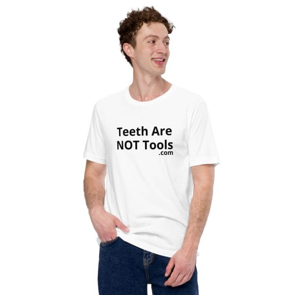 white Teeth Are Not Tools Tee Shirt on White male wearing blue jeans